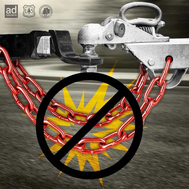 一幅插圖，描繪了用鏈條拖著一輛拖車，拖車上有一個被劃掉的「禁止」標誌。